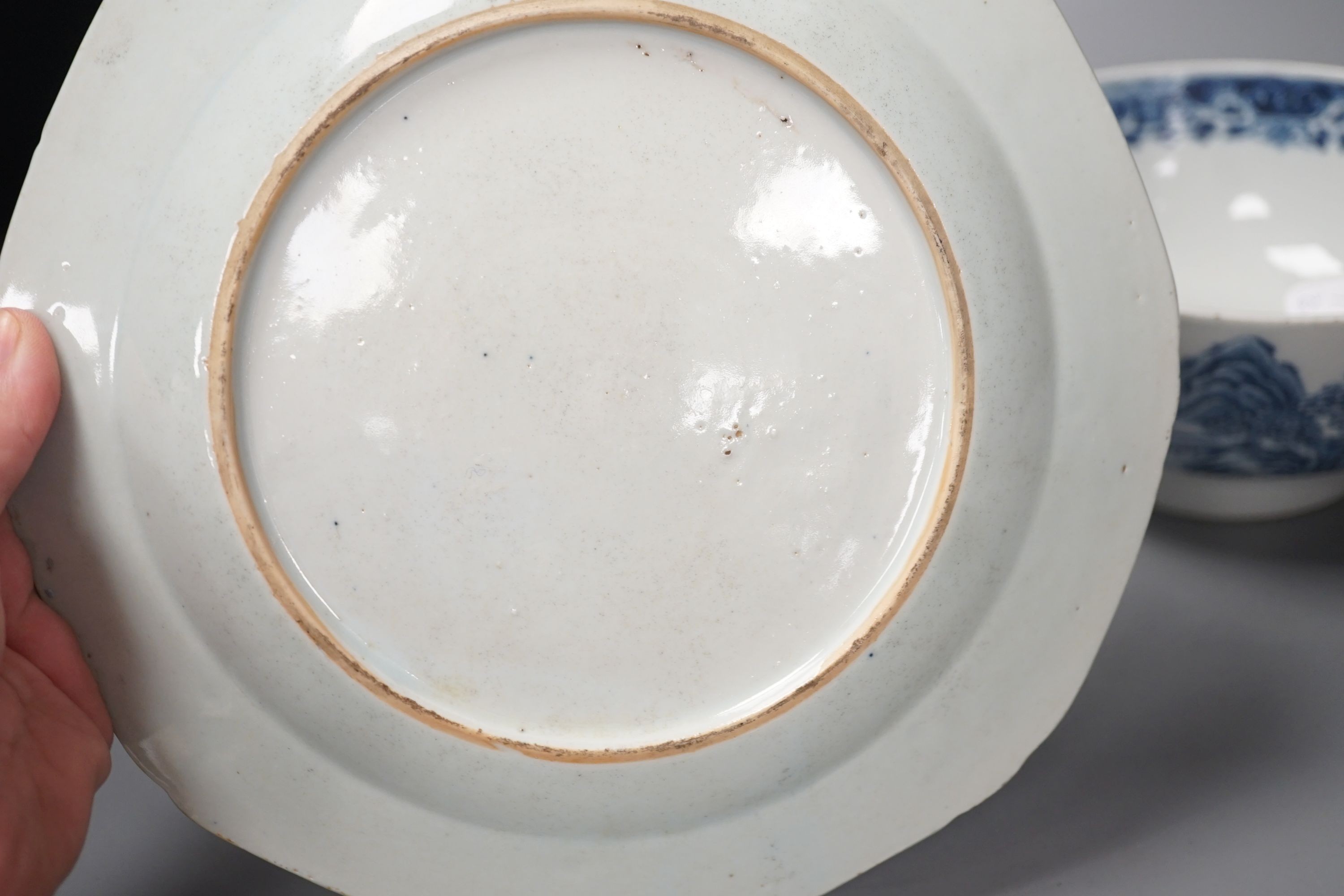 An 18th century Chinese famille rose ‘birds and lotus’ plate, and a Chinese blue and white ‘landscape’ bowl, 17.6cm